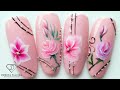 One stroke flowers nail art with acrylic paints.