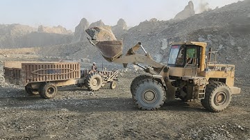 Giant Caterpillar 966D Wheel Loader: An Incredible Rock Loading Video