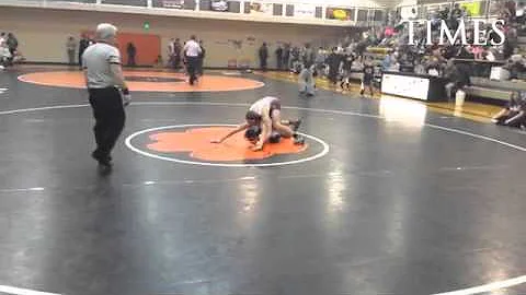 Cameron Holm of Wiggins wrestling at 126 vs. Merin...