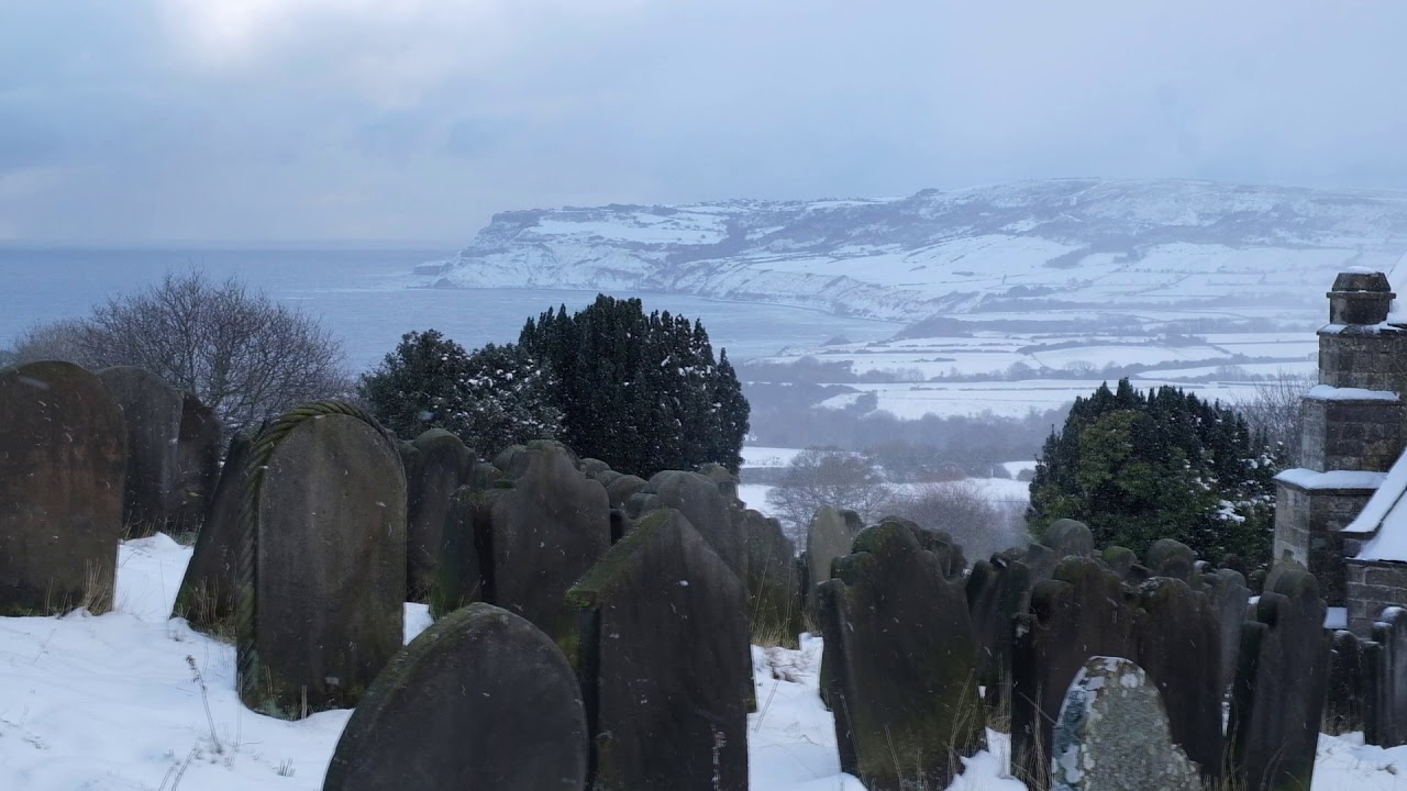 Snowing At Robin Hoods Bay. Winter Snow At Whitby In North Yorkshire