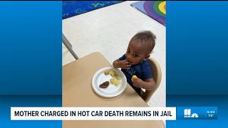 Mother charged in hot car death remains in jail