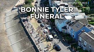 Bonnie Tyler funeral procession aerial Mumbles Swansea 2026 longer