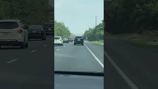 Driving behind SUV Cadillac