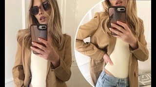 Abbey Clancy looks stunning as she poses up a storm in a high-legged cream bodysuit and brown blazer