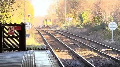 Scarborough train Class 170 departs and the Hull Class 155 arrives Beverley Railway Station 
