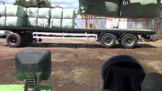 Unloading and stacking 60 bales haylage