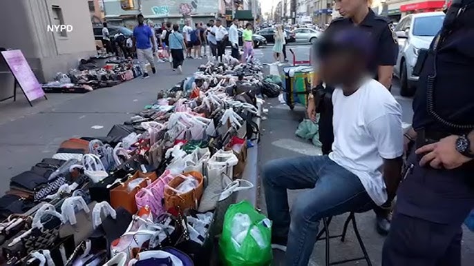 New York, United States. 09th Nov, 2020. Street vendors sell counterfeits  goods like bags, sunglasses, belts and watches on Canal street and Broadway  corners. Because of pandemic those sales are far and