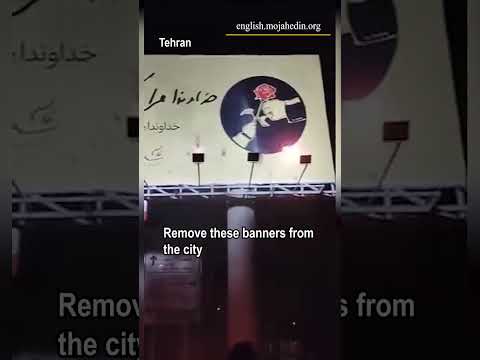 Protesters torch Qassem Soleimani poster in Tehran