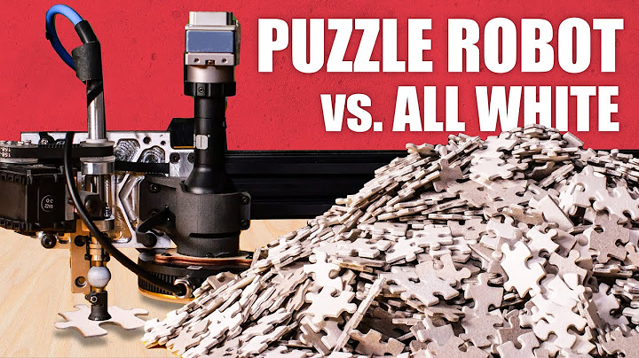 Worlds hardest jigsaw vs. puzzle machine (all white)