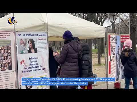 Paris—December 19, 2023: MEK supporters organized an exhibition to support the Iranian Revolution.