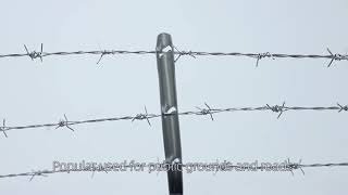 chain link fence with top barbed wire