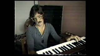 strange man with bi-colored moustache playing vulfpeck in the 80's