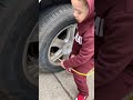 Papas putting air in tire