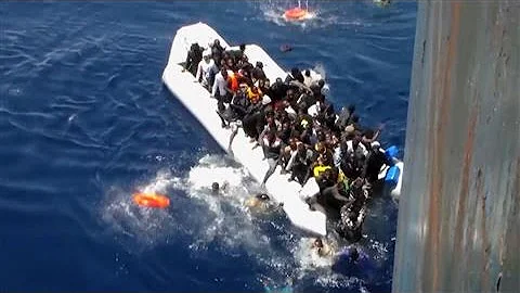 Migrants Flee Sinking Dinghy in Dramatic Footage - DayDayNews