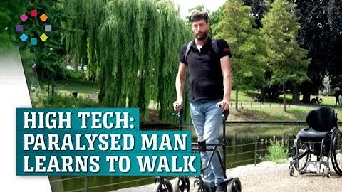 Paralyzed man walks again with brain-spine device
