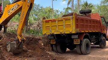 Jcb 3dx loading truck with soil 