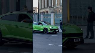 Green Lamborghini Urus stuck in London traffic