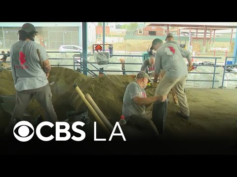 Team Rubicon helps fill and distribute sandbags in Newport Beach ahead of potential flooding
