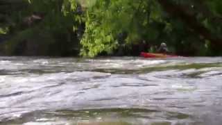 A kayaker on the Guadalupe River while it is flowing at over 5000 cfs.