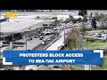 Protesters block road to seatac airport