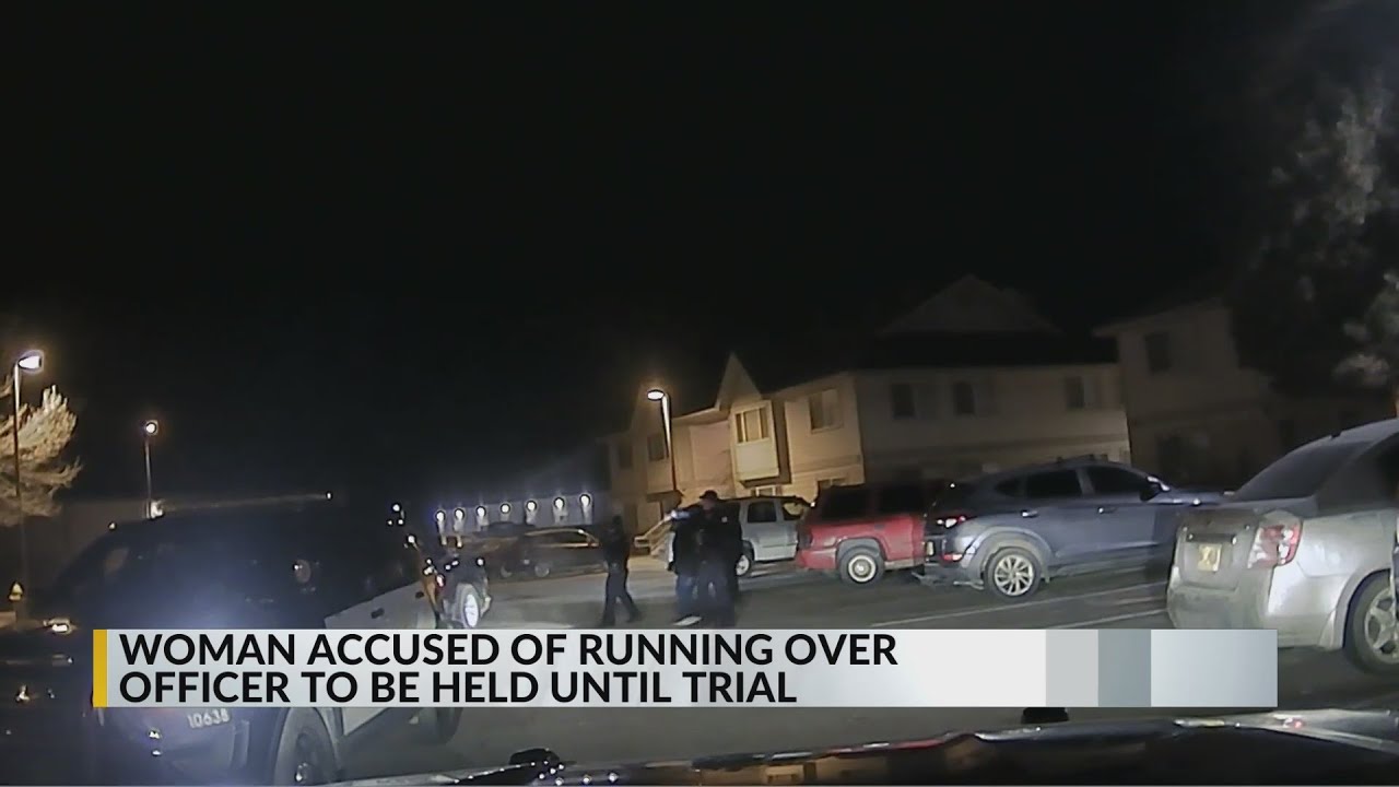 Woman accused of running over Farmington officer being held until trial ...