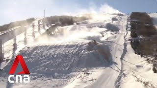 Beijing Winter Olympics organisers battle low temperatures as they create artificial snow