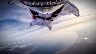 wingsuit flying over the clouds of empuriabrava