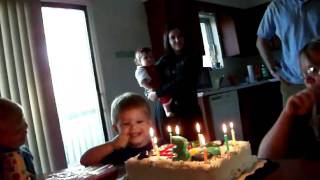 Singing Birthday song to Sammy, and blowing out candles.