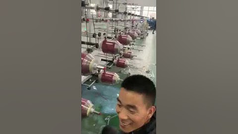 Spooling rewinding machine for heat activated adhesive