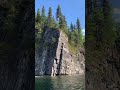Cruising along a rock face at Williston Lake