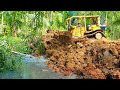 Fast work the cat d6r xl bulldozer piles soil into a hole that is hundreds of years old