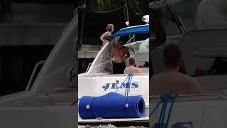 Woman Takes a Spill on Yacht's Edge!  #YachtMishap #CloseCallAtSea