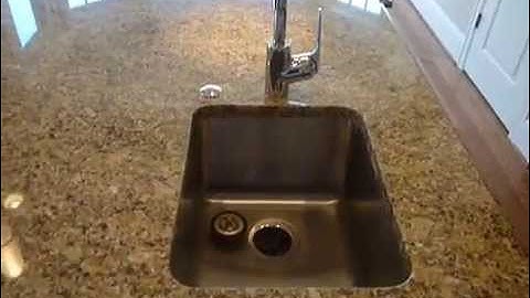 Granite Counter tops and tile backsplash by Stonewood Design, Inc.