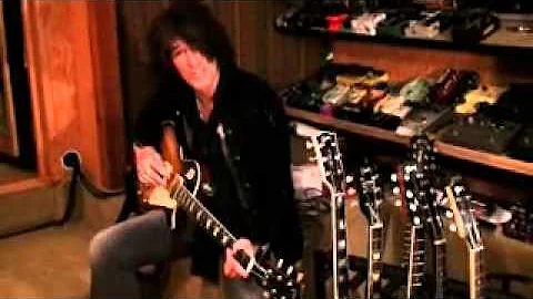 Joe Perry holding his 1959 Les Paul Standard Darkb...