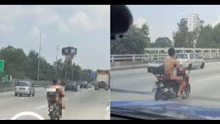 Tular video lelaki bogel tunggang motosikal.