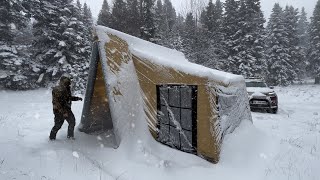 COZY TENT CAMP WITH STOVE IN A BLIZZARD