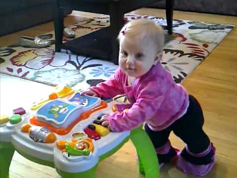 lila using toy as a walker