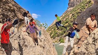 Nomadic Men Crossing through the Dangerous Mountain for Fishing