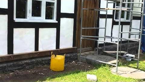 Lime washing after repairs to timber frame