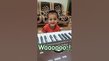 Cute Baby playing Korg Pa 700 keyboard