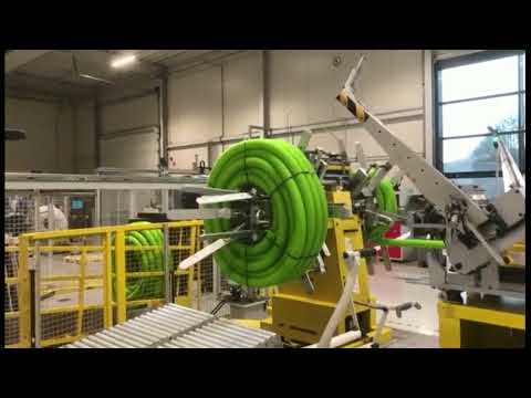 Double wall corrugated hose coiling and strapping machine