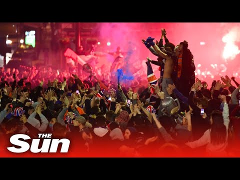 Rangers fans celebrate in George Square, Glasgow after Scottish Premiership title win.