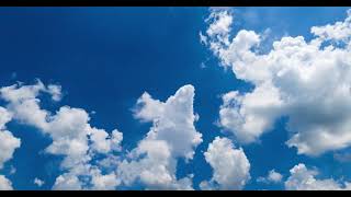Sky's Elegance Unveiled: Timelapse of Beautiful Blue Sky with Puffy White Clouds