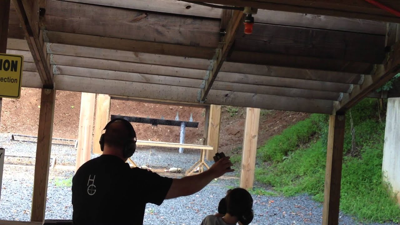Young kid shoots better than most adults in bowling pin shooting