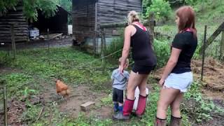 Amber and Kayla Feeding the Goats