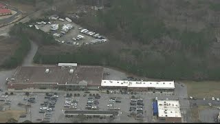 Human remains found in woods behind Holly Springs shopping center, police say