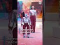 Robots and human models walk the runway in matching outfits in Seoul