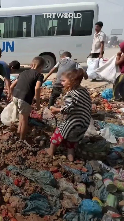 Children search garbage for food amid Israeli blockade in Gaza