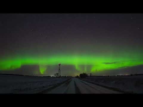 Geminid Meteors Soar Past Dancing Aurora