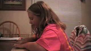 Maddy reading her Weekly Reader